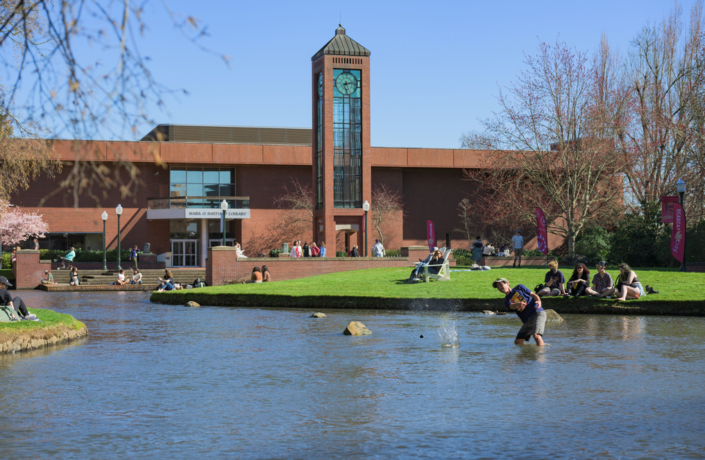 Students enjoying the Mill Stream in Spring